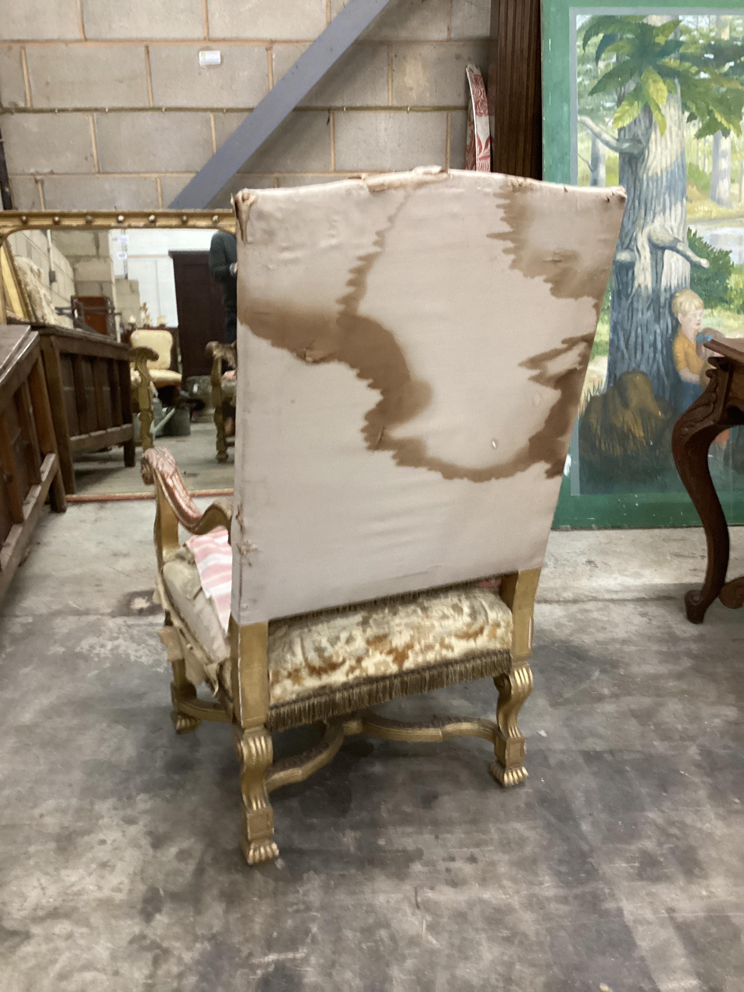 A Louis XIV style carved giltwood armchair, width 66cm, depth 64cm, height 118cm